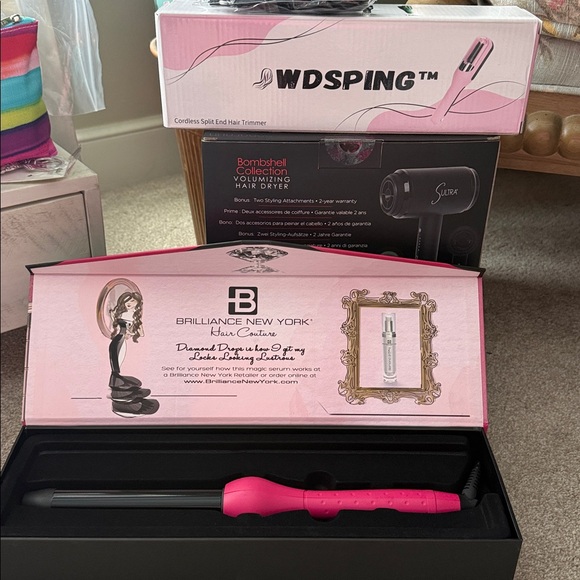 Brilliance New York Other - Beautiful pink curling iron. Only sold during runway shows. All New in Box.